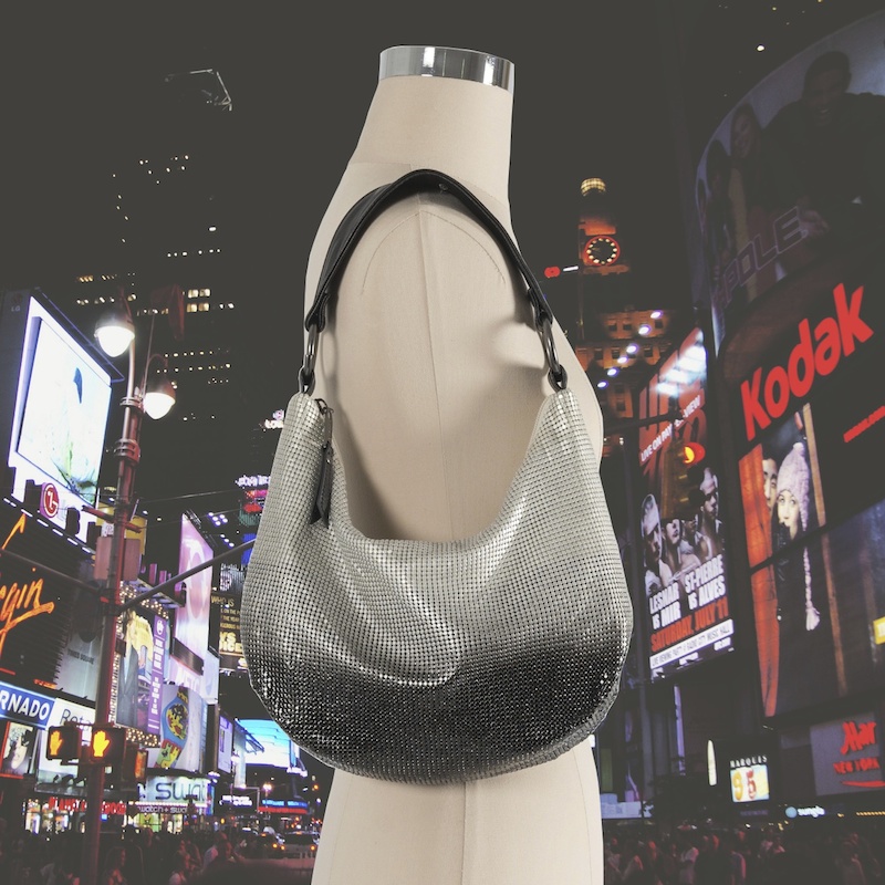 Ombre shoulder bag in pearl and black on a city background